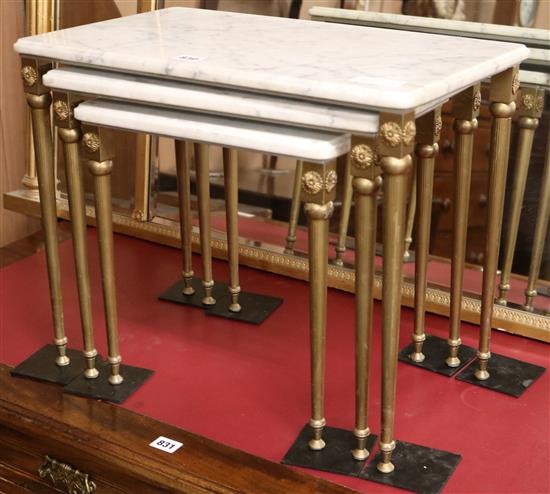 A nest of three marble and brass tables W.51cm